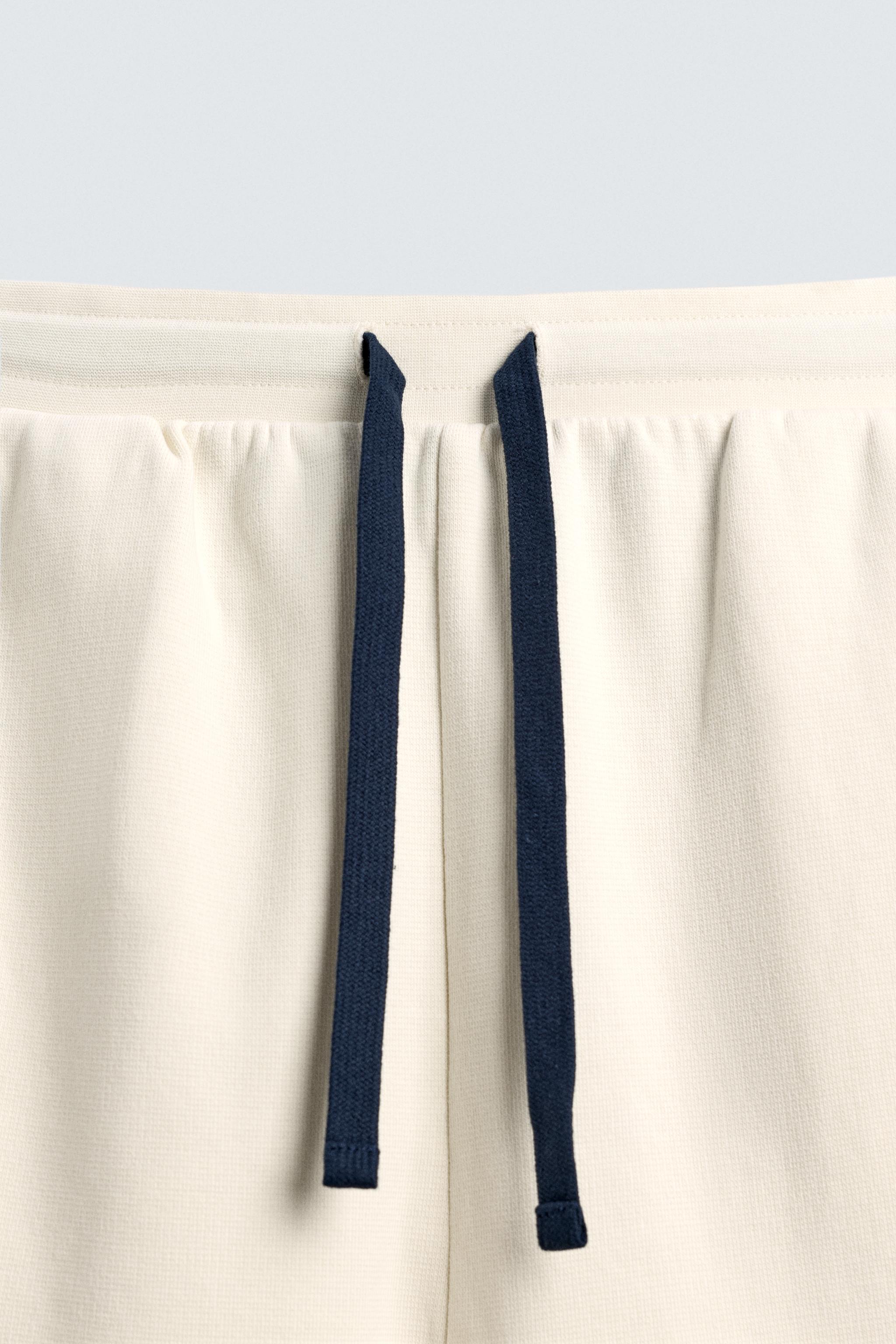 BERMUDA JOGGING BANDES CONTRASTÉES